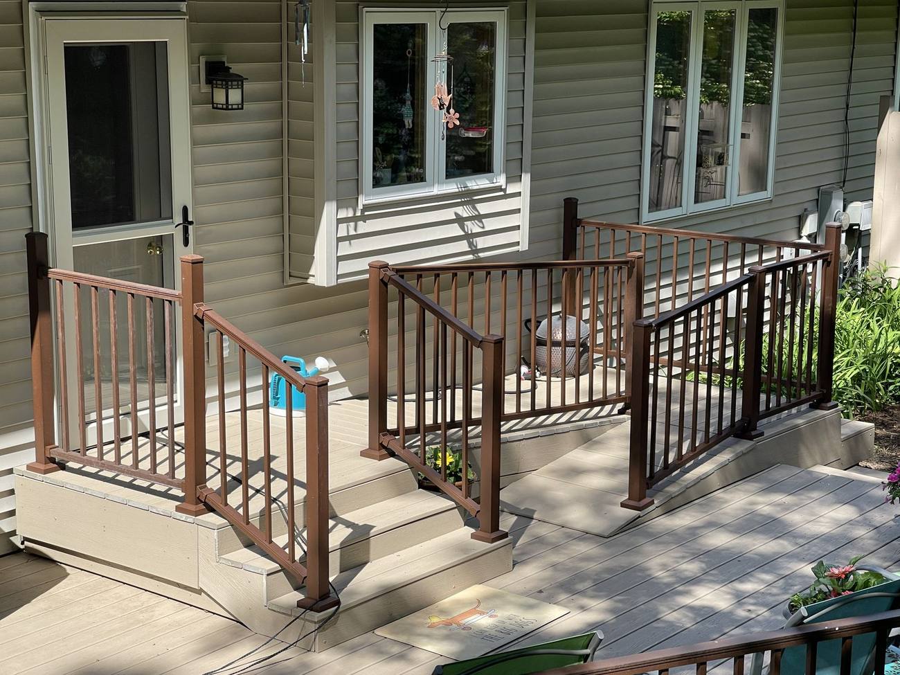 New metal deck railings installed on composite deck and steps by Ask Adam, Madison WI