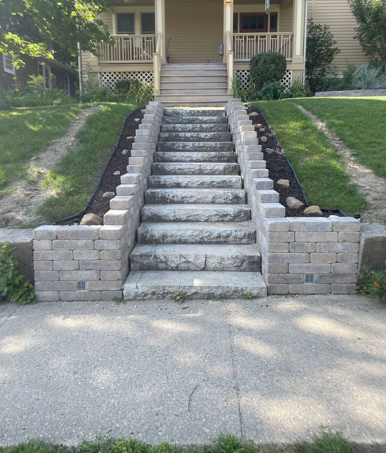 Rebuilt stone paver staircase with retaining walls, geogrid and french drains by Ask Adam, Madison WI